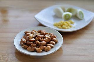 Mapo Tofu with Peanuts step 1: Fry peanuts until golden and crispy, then let them cool before peeling. Chop gin