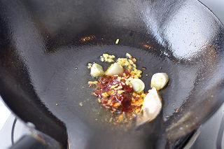 Mapo Tofu with Peanuts step 12: Add one tablespoon of Sichuan chili bean paste and stir-fry until fragrant.
