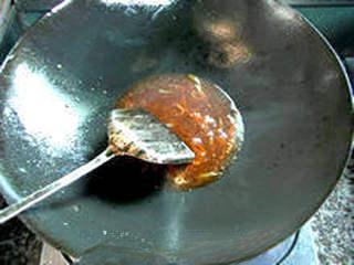 Recipe step 14: Add the prepared tomato sauce and stir-fry over medium heat until it bubbles and