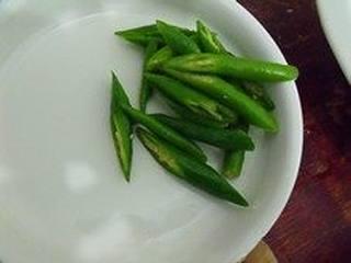 Recipe Title step 2: Cut the green bell peppers into strips.
