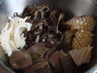 Mao Xue Wang (Sichuan Spicy Duck Blood Hot Pot) step 5: Blanch the duck blood, beef tripe, tofu skin, and squid separately. Drain and se