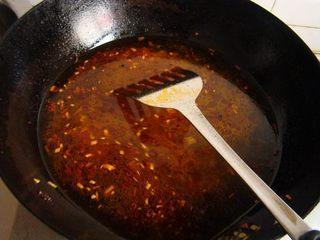 Mao Xue Wang (Sichuan Spicy Duck Blood Hot Pot) step 8: Pour in water or chicken stock and bring to a boil.