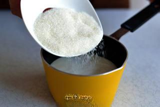 Milk Pudding with Caramel Sauce step 1: In a pot, heat milk and 35g of sugar over water, stirring continuously until the