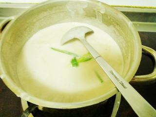 Soup Dumplings (Xiao Long Bao) step 12: Add green onion knots and simmer gently for 30 minutes.