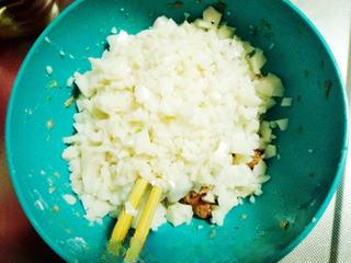 Soup Dumplings (Xiao Long Bao) step 19: Dice the chilled pork aspic and fold it into the seasoned pork filling.