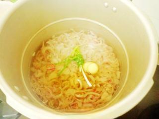 Soup Dumplings (Xiao Long Bao) step 5: Place the pig skin in a pressure cooker with ginger, green onions, and rice wine
