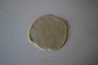 Savory Pork Pastries step 12: Flatten and roll each piece into a round wrapper.