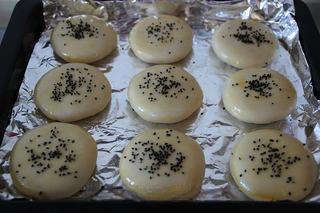 Savory Pork Pastries step 17: Sprinkle with sesame seeds. Bake in a preheated oven at 200°C (392°F) for about 