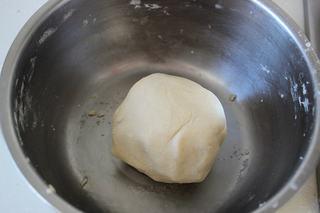 Savory Pork Pastries step 2: Mix the flour and lard for the shortcrust dough until a smooth dough forms.