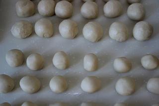 Savory Pork Pastries step 5: Divide both the water-oil dough and shortcrust dough into 18 equal portions. Let