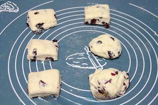 Chocolate Chip Cranberry Cookies step 12: Preheat the oven to 210°C (410°F). Flatten one dough portion and place some chop