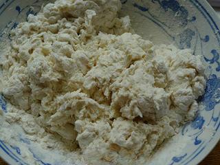 Leek and Dried Shrimp Stuffed Pan-Fried Pancakes step 1: Place the flour in a mixing bowl and gradually add the hot water while stirring