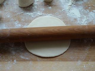 Leek and Dried Shrimp Stuffed Pan-Fried Pancakes step 15: Flatten and roll each piece into a thin round wrapper.
