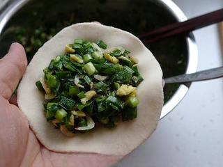 Leek and Dried Shrimp Stuffed Pan-Fried Pancakes step 16: Place a generous spoonful of filling in the center.
