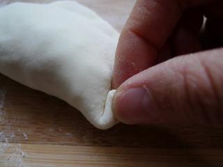 Leek and Dried Shrimp Stuffed Pan-Fried Pancakes step 18: Create decorative pleats around the edge by pinching and folding the dough.