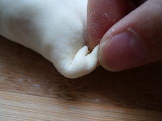 Leek and Dried Shrimp Stuffed Pan-Fried Pancakes step 19: Continue pleating until the entire edge is sealed.