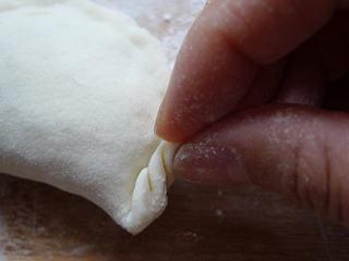Leek and Dried Shrimp Stuffed Pan-Fried Pancakes step 20: Ensure the pleats are even and the filling is fully enclosed.