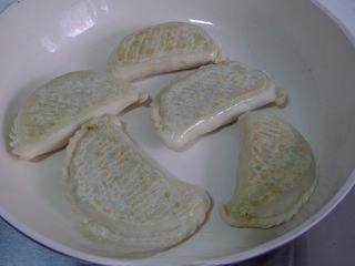 Leek and Dried Shrimp Stuffed Pan-Fried Pancakes step 22: Heat a lightly oiled skillet over medium-low heat. Cook the stuffed pancakes unt