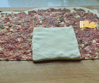 Beef and Scallion Stuffed Pancake step 12: Seal the edges and gently flatten each filled dough packet.
