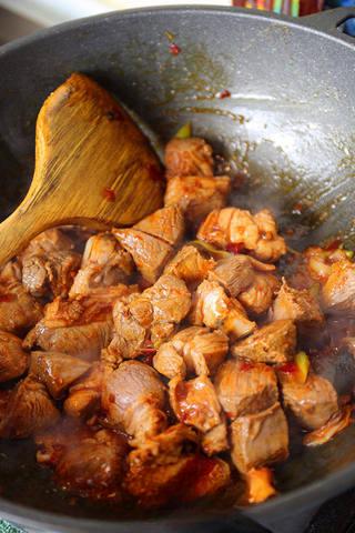 Braised Lamb Leg with Carrots step 5: Add sugar, Shaoxing wine, and soy sauce. Stir well to coat the lamb evenly.