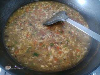 Beef and Vegetable Egg Drop Soup step 15: Slowly drizzle in the beaten egg while stirring gently to create egg ribbons.