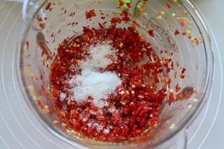 Homemade Chili Garlic Paste Recipe step 5: Add the salt and sugar, then mix thoroughly.