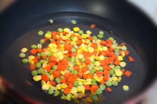 Thai Fried Rice with Vegetables and Seafood step 5: Blanch the corn kernels, green peas, and diced carrots briefly in boiling water,