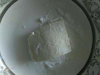 Pan-Fried Tofu with Egg and Bell Peppers step 5: Lightly coat both sides of the tofu slices with cornstarch.