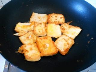 Pan-Fried Tofu with Egg and Bell Peppers step 8: Pan-fry the tofu until both sides are golden brown. Remove and set aside.