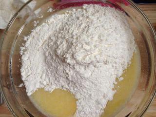 Oatmeal Muffins step 5: Sift the bread flour and baking powder together, then fold them into the wet mix