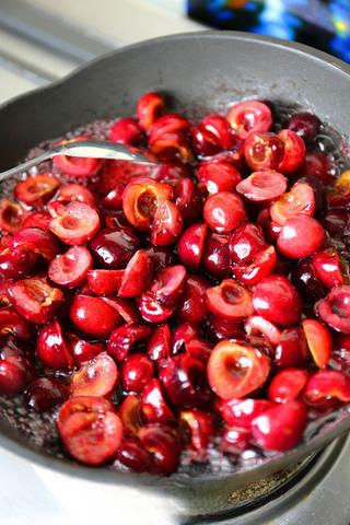 Cherry Chocolate Tart step 12: Cook the macerated cherries with rum over medium heat until softened.