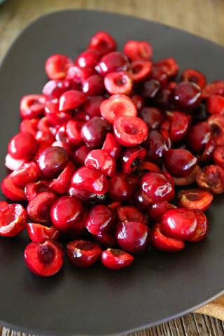 Cherry Chocolate Tart step 6: Wash the cherries, remove the pits, and cut them in half.