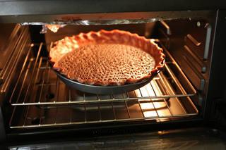 Cherry Chocolate Tart step 9: Prick the bottom with a fork. Bake in a preheated 200°C oven for 15 minutes. Rem