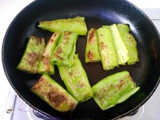Tiger Skin Green Peppers step 8: Return the blistered peppers to the pan and toss briefly to coat with the aromat