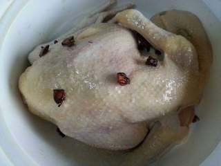 Five-Spice Roasted Chicken step 6: Pour the Shaoxing wine over the chicken and continue massaging until evenly coat
