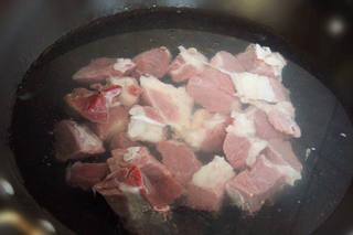Beef and Vegetable Stew step 3: Heat oil in a wok or large pot. Add ginger, scallions, dried chilies, and star a