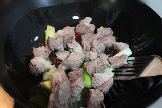 Beef and Vegetable Stew step 5: Stir in the tomato paste and rock sugar. Cook until the sugar melts and coats th