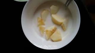 Candied Apple Fritters step 5: Dip each apple piece into the batter, ensuring it is fully coated.