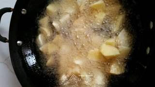 Candied Apple Fritters step 6: Fry the coated apple pieces until golden brown and crisp.