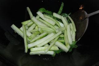 Stir-Fried Cucumber Peel and Green Peppers step 5: Add the cucumber peel and continue stir-frying until both vegetables are crisp-t
