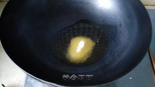 Braised Chicken Feet step 5: Heat oil in a wok and add the sugar.