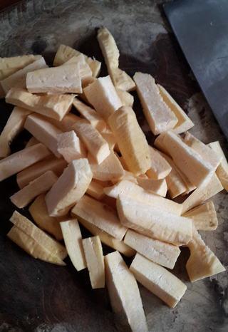 Candied Sweet Potato Fries step 2: Cut the peeled sweet potatoes into sticks and set aside.