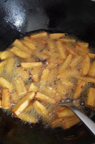 Candied Sweet Potato Fries step 4: Fry until golden brown, remove from oil and drain excess oil.