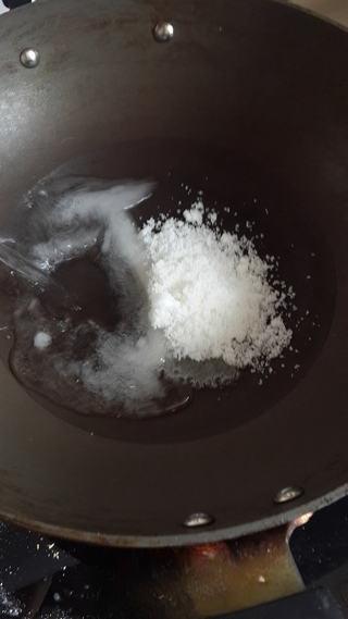 Candied Sweet Potato Fries step 5: In another pot, combine water and sugar and stir over low heat until dissolved.