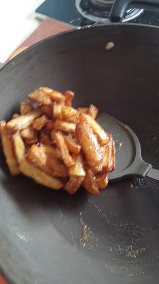 Candied Sweet Potato Fries step 7: In a bowl, mix in the sweet potato until well combined.