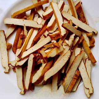 Stir-Fried Dried Tofu with Green Onions and Chili step 2: Cut the dried tofu into thin strips.
