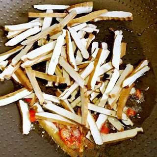 Stir-Fried Dried Tofu with Green Onions and Chili step 5: Add the dried tofu strips and stir-fry for 1–2 minutes until evenly coated with