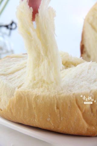 Soft Milk Sandwich Bread Recipe step 12: Enjoy the soft, fluffy texture with visible strands in the crumb.