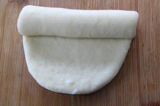 Soft Milk Sandwich Bread Recipe step 7: Punch down the dough, divide it into equal portions, shape each piece into a rol