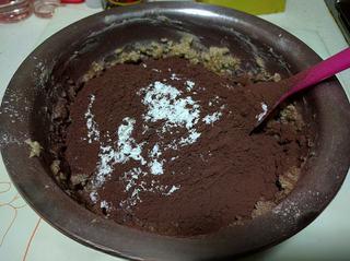 Chocolate Butter Cookies step 6: Sift in the cake flour and cocoa powder.